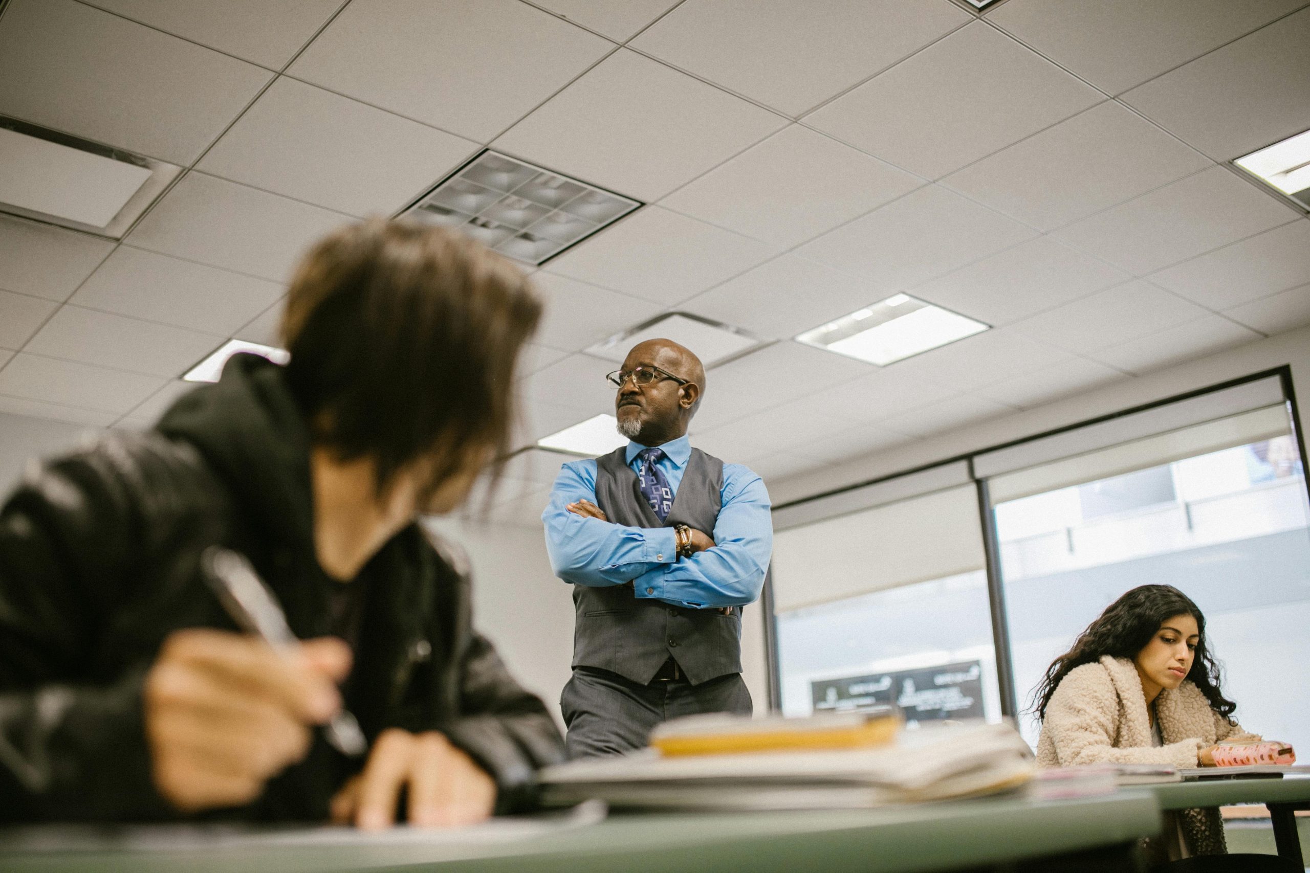Is a professor allowed to call out disability accommodations in front of the whole class? Or make a “objectively harder and longer” alternative exam?