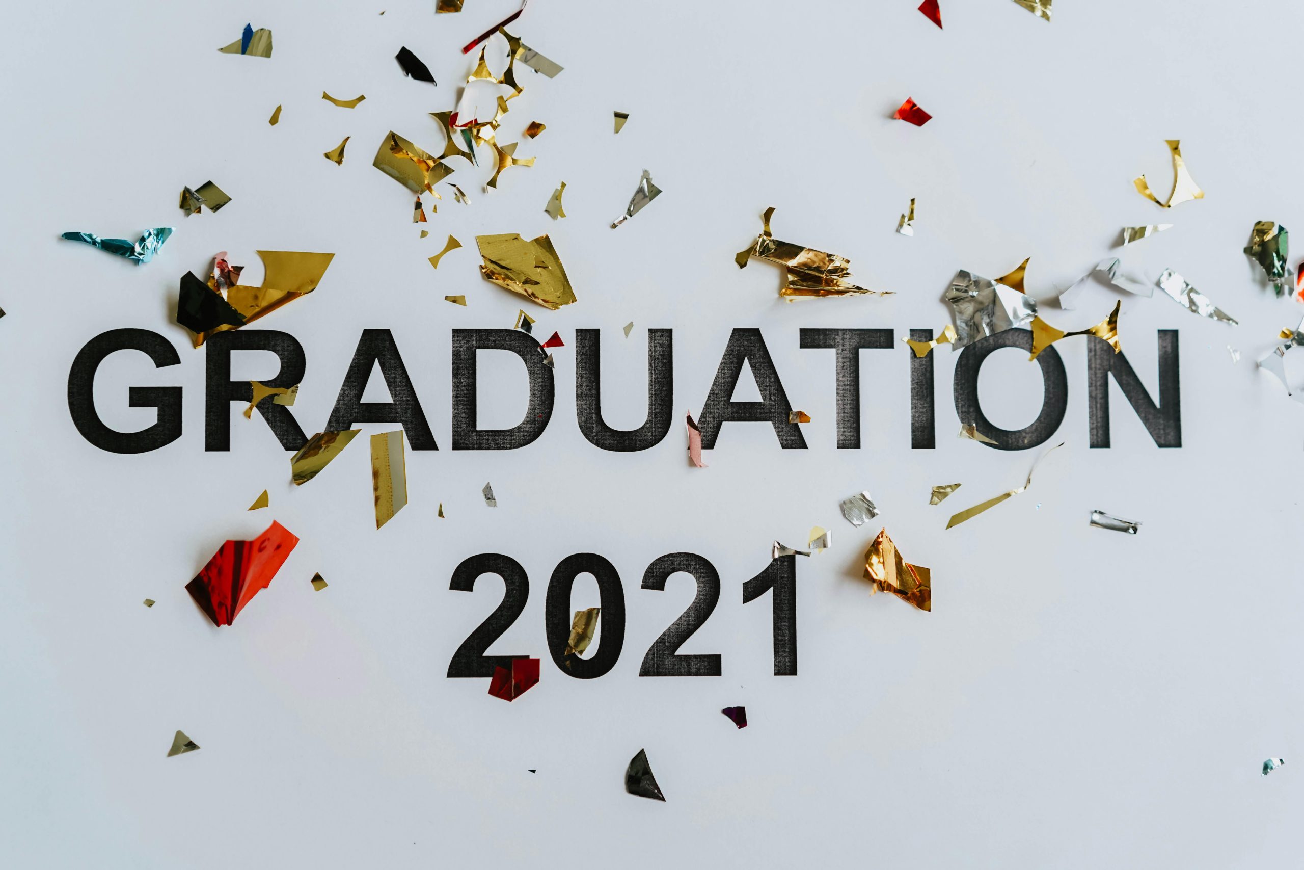 Graduate a year earlier or take some graduate classes?